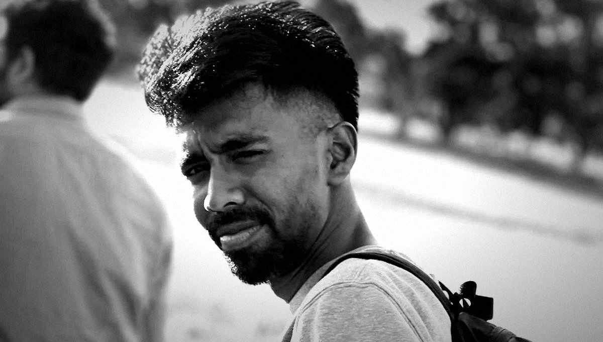 AJ Ling, black and white over-the-shoulder portrait